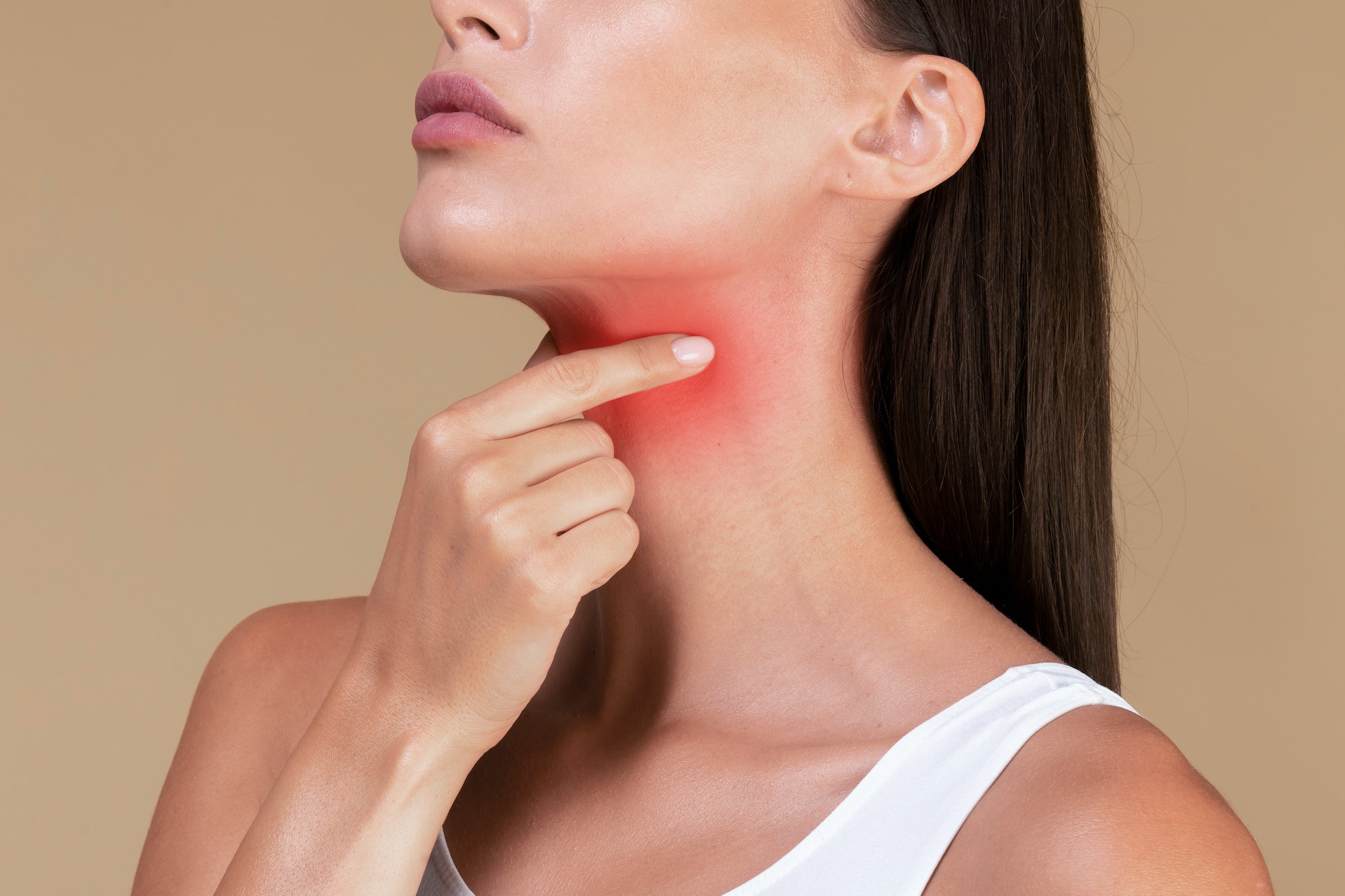 Closeup of unrecognizable sick lady suffering from sore throat, touching neck with hand, inflamed